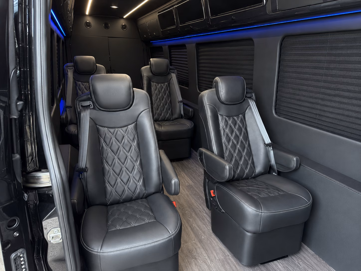 pontiac sprinter van with driver inside
